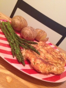 Parmesan crusted chicken, accordion Yukon Gold potatoes, and asparagus 